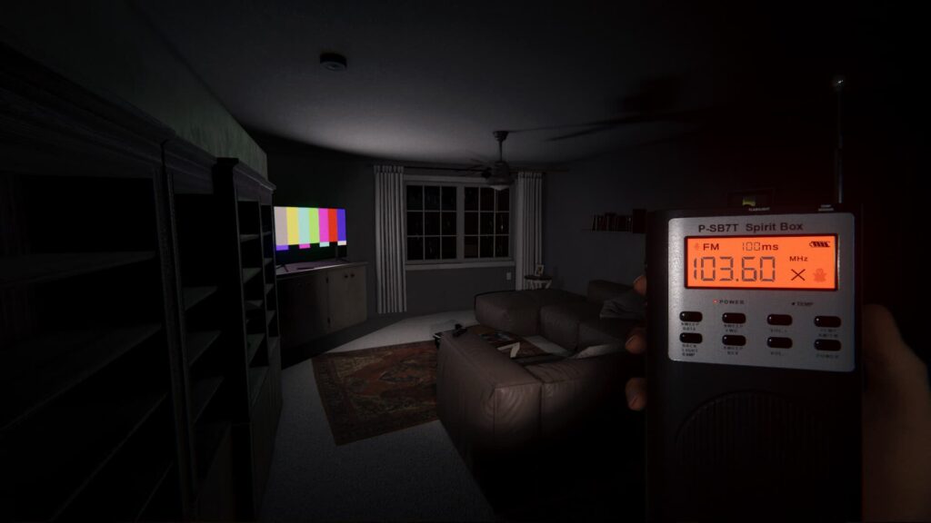 A player uses their spirit box in a living room in Phasmophobia.