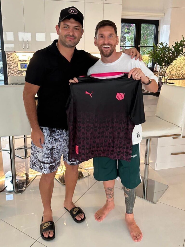 Leo Messi poses with a KRÜ Esports jersey earlier in the year (Image via KRÜ Esports)
