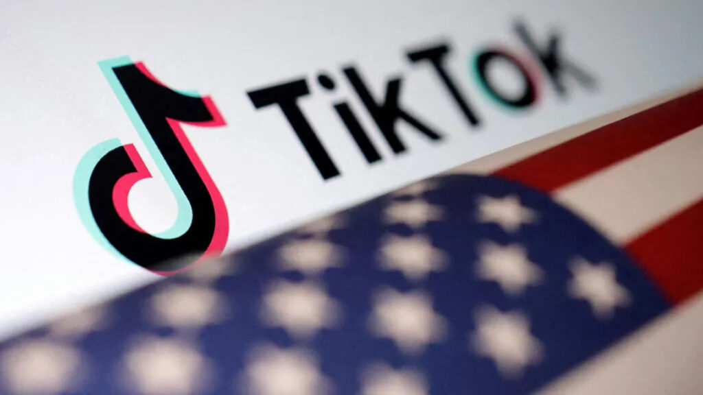 TikTok text logo over an American flag in the foreground (Image via BBC)