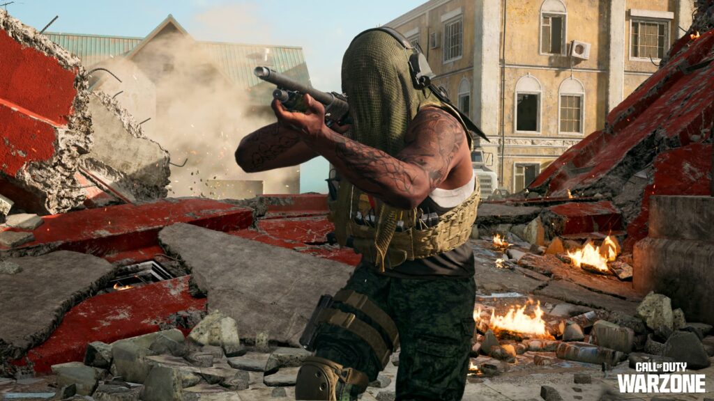 A player fights through a broken down building with a shotgun in Call of Duty: Warzone Season 3 Reloaded.