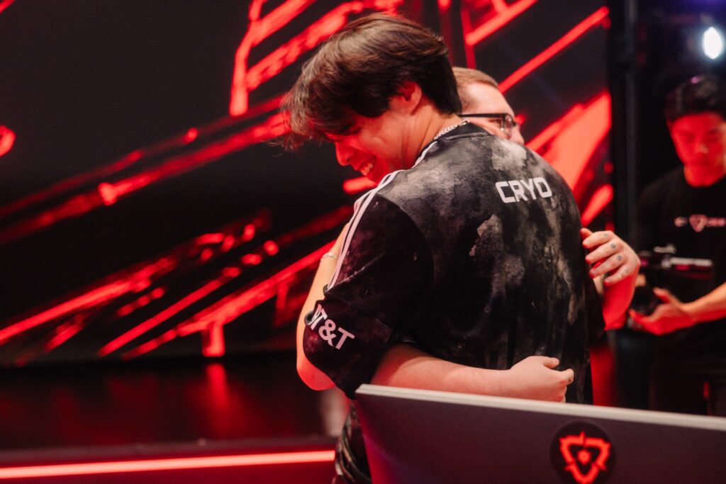 “Boostio” (L) and Cryo of 100 Thieves hug onstage after victory during VCT Americas Mid-Season Playoffs at the Riot Games Arena on May 10, 2024. 