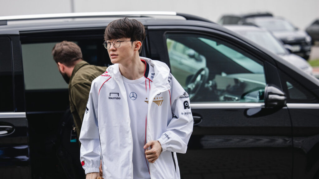 Faker dressed with the official T1's Worlds 2024 jersey and jacket (Image via Colin Young-Wolff and Riot Games)