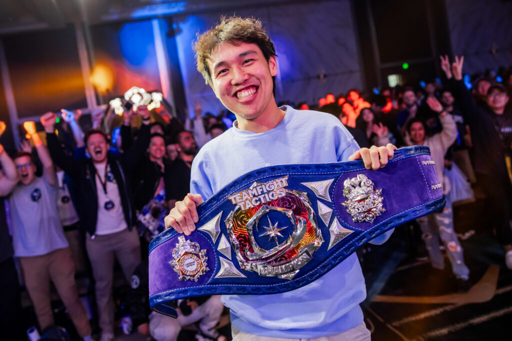 milala poses with the Tactician's Belt after winning the 2023 TFT Vegas Open (Photo via Colin Young-Wolff / Riot Games)