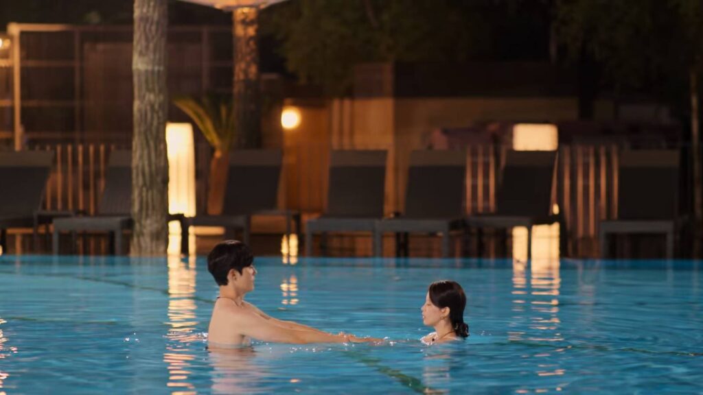 Kim A-Rin and Kook Dong-Ho in a pool (image via Netflix)