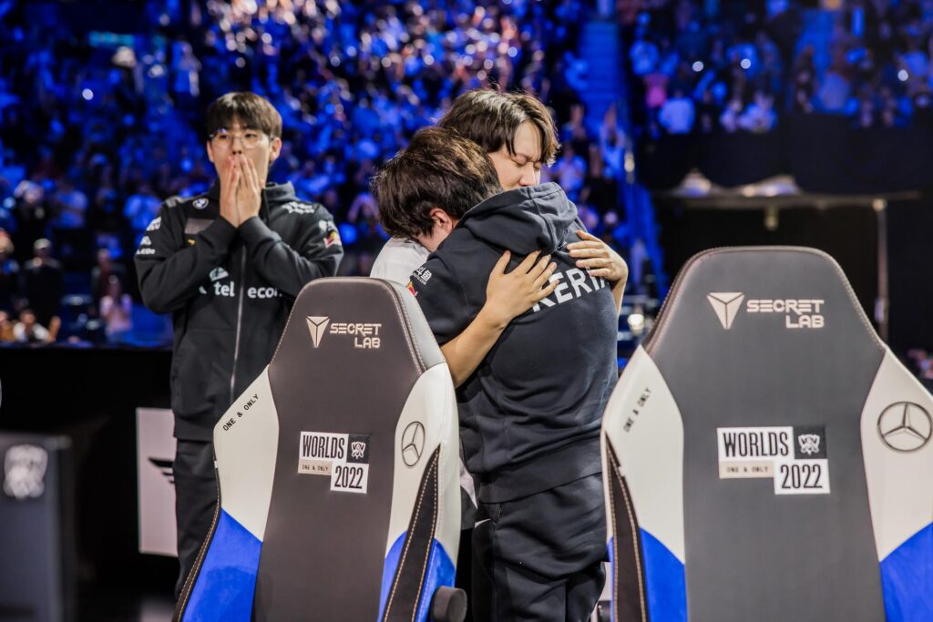 Keria and Pyosik hug at the Worlds 2022 stage (Photo by Lance Skundrich/Riot Games)