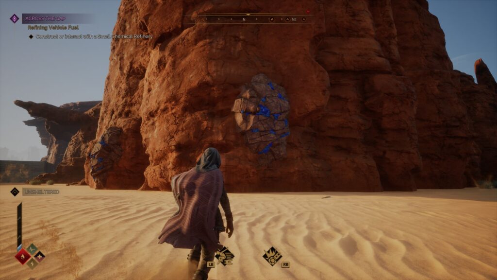 Break down blue rocks to get Copper Ore. (Screenshot by esports.gg)