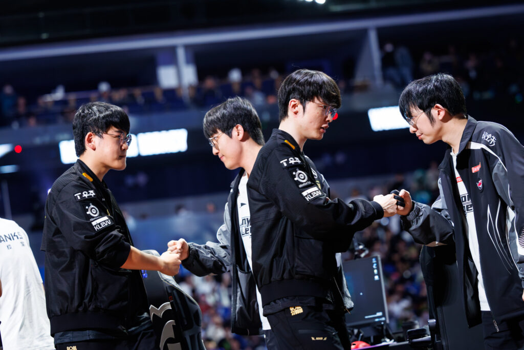 T1 and Al after the match (Photo via Riot Games | Yicun Liu)